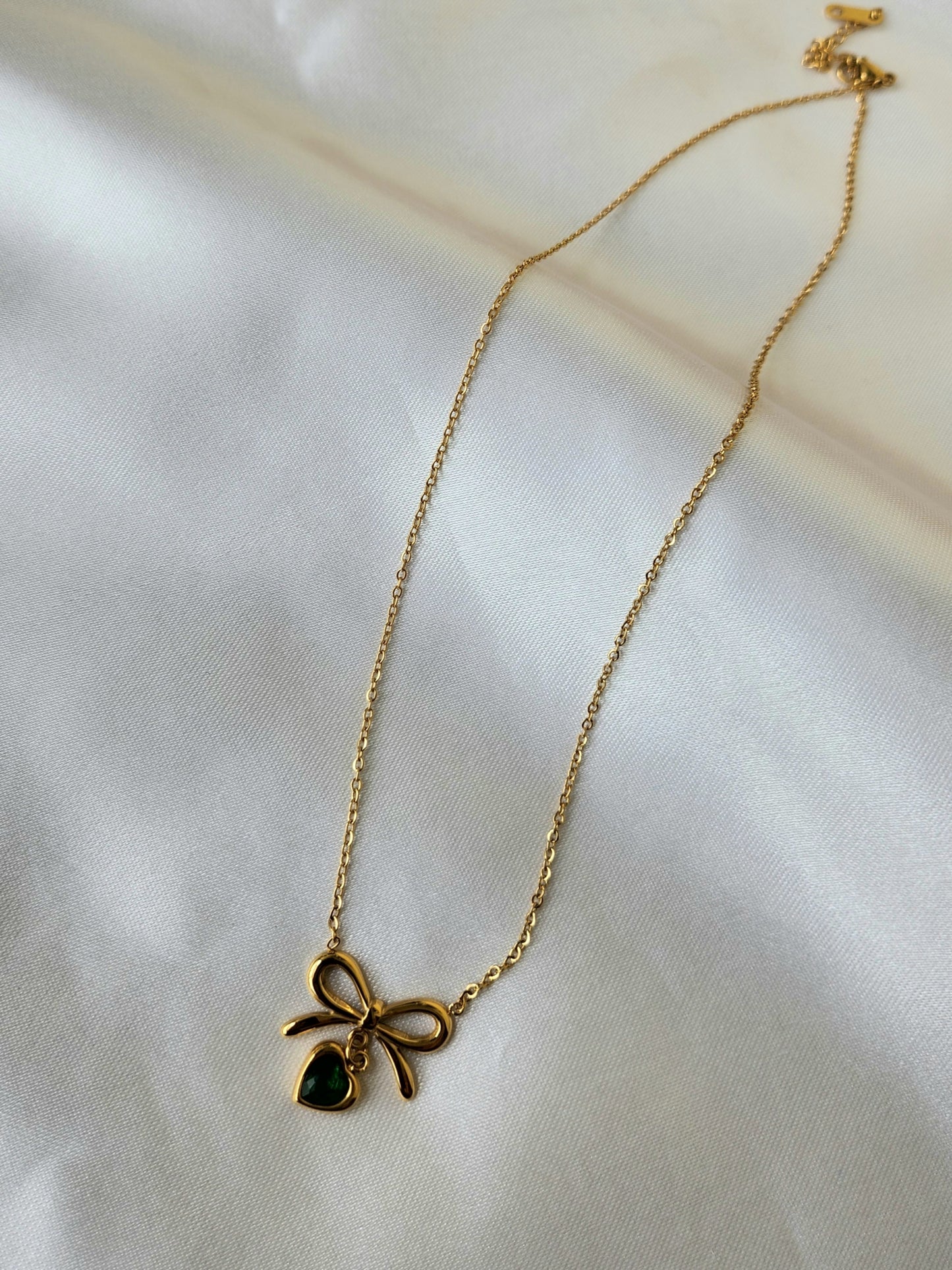 Bow and Heart Pendant Necklace with Green Accent